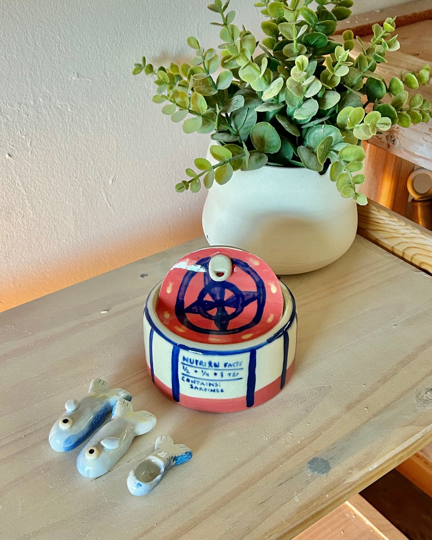 wheel sardine tin + teaspoons