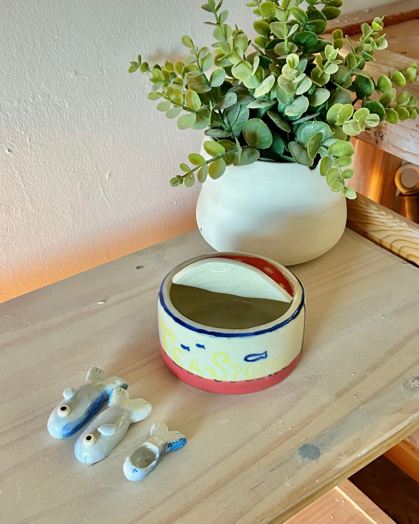 wheel sardine tin + teaspoons