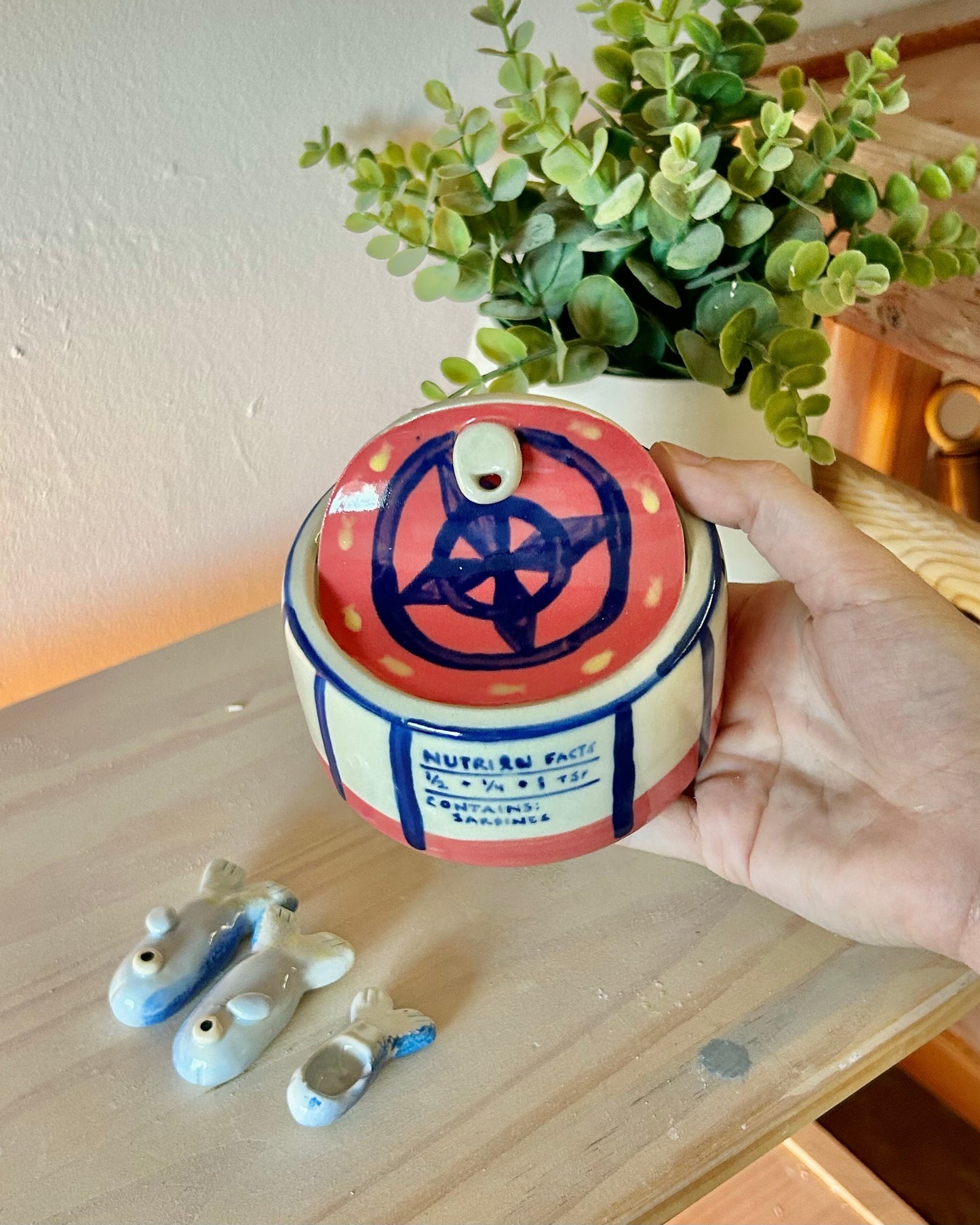 wheel sardine tin + teaspoons